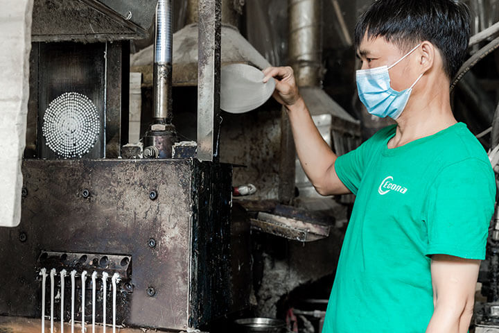 Our worker is manipulating our pelleting machine.